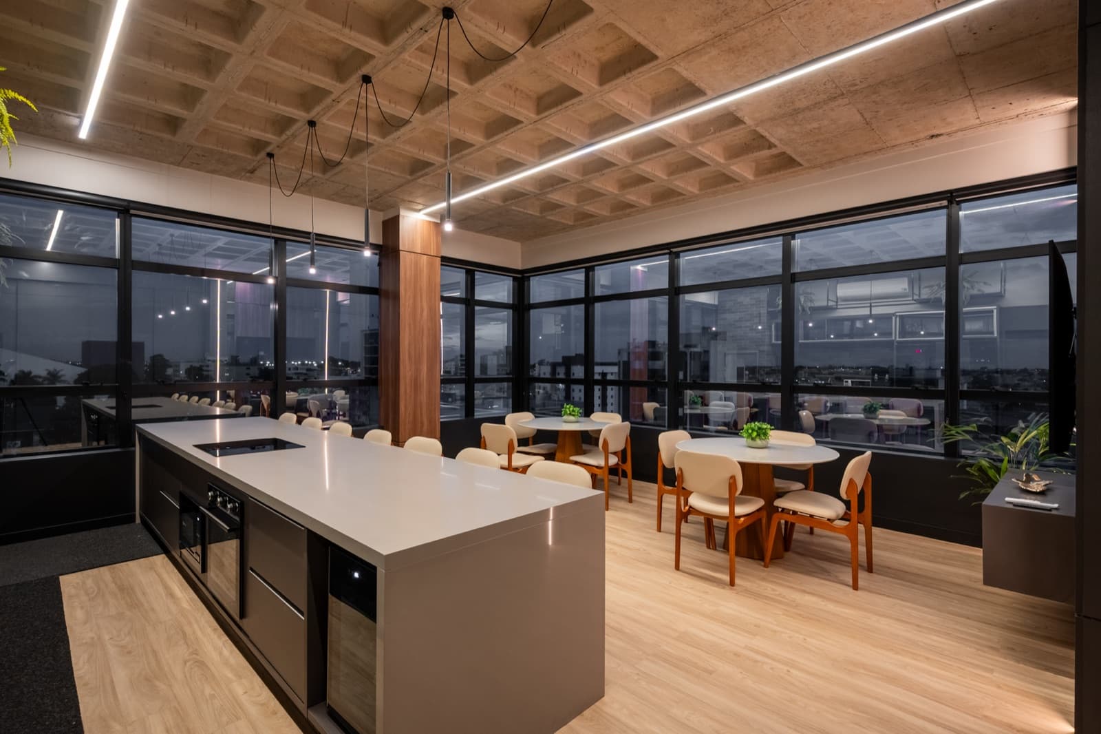 Evolua staff café with counter, wooden stools and panoramic windows